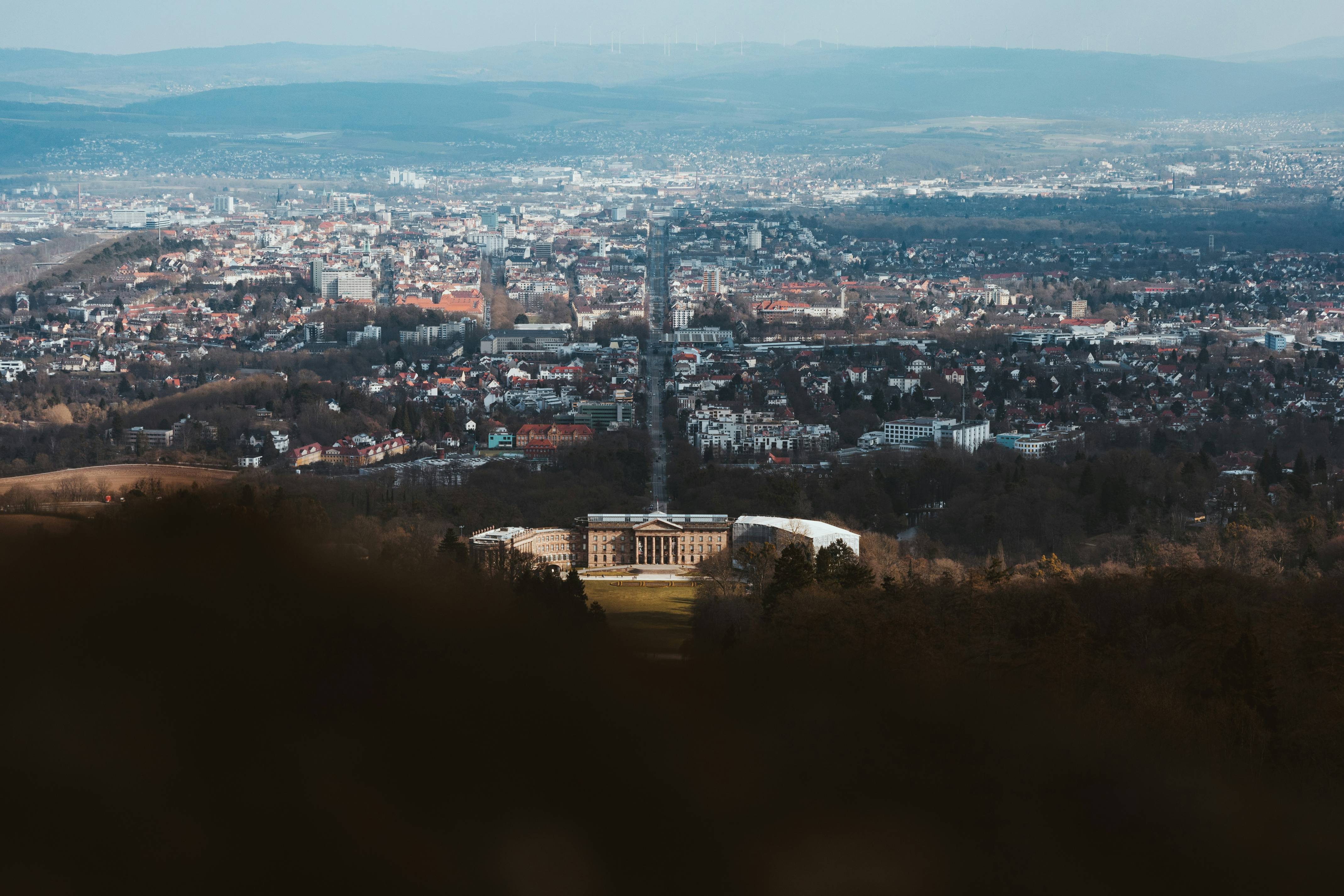 a view of a city from the top of a hill