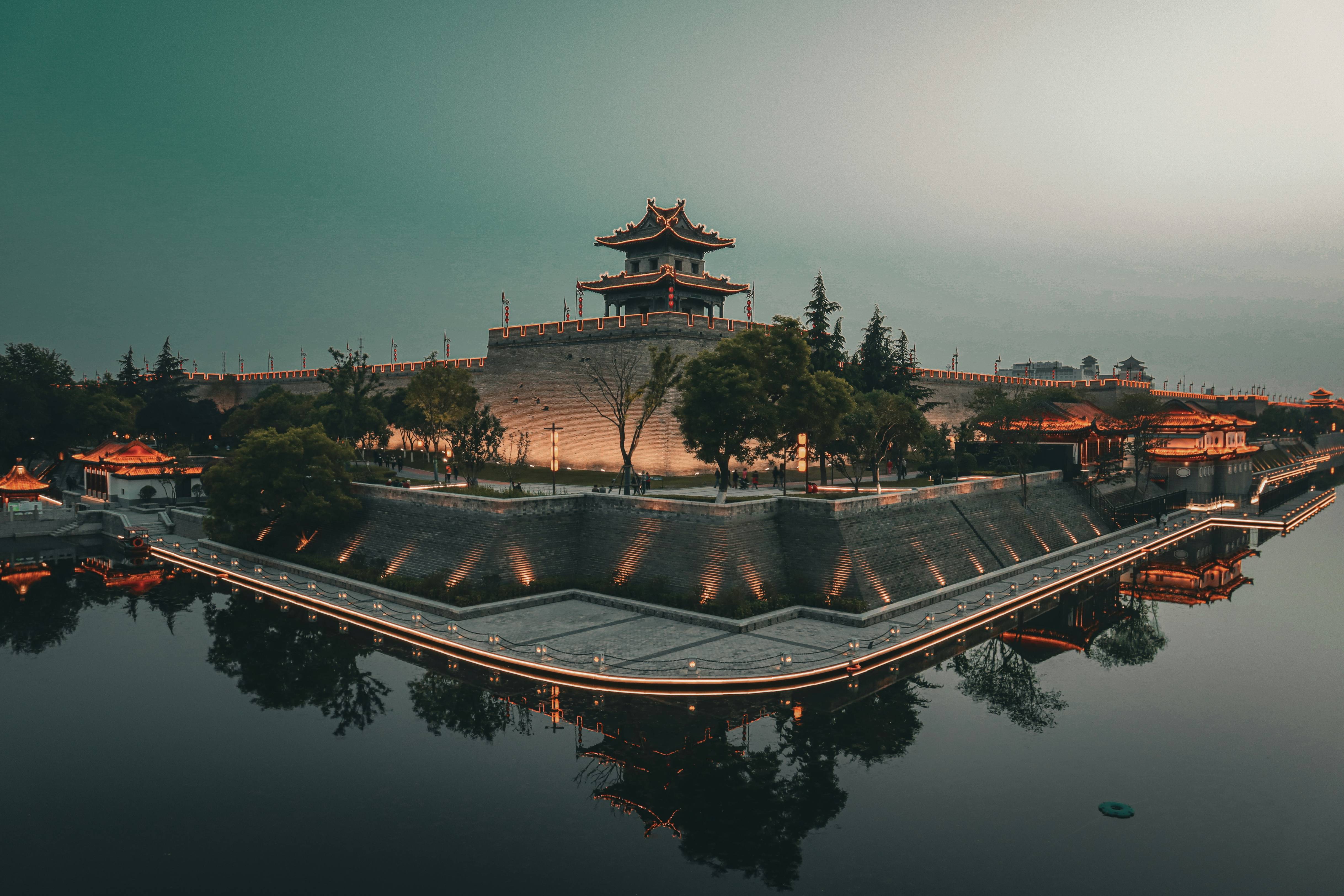 A large building sitting on top of a body of water