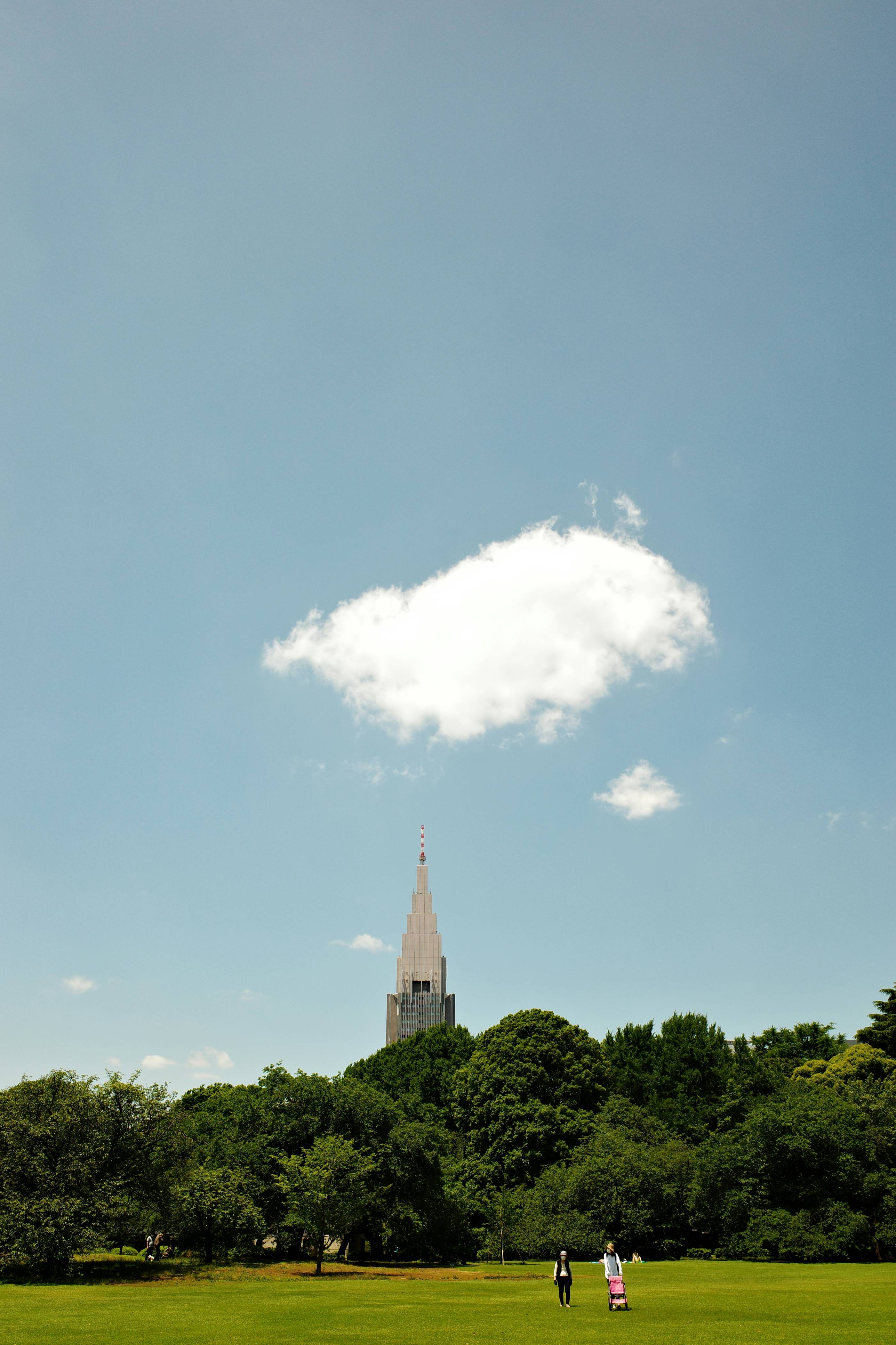 a tall building with a tower in the background