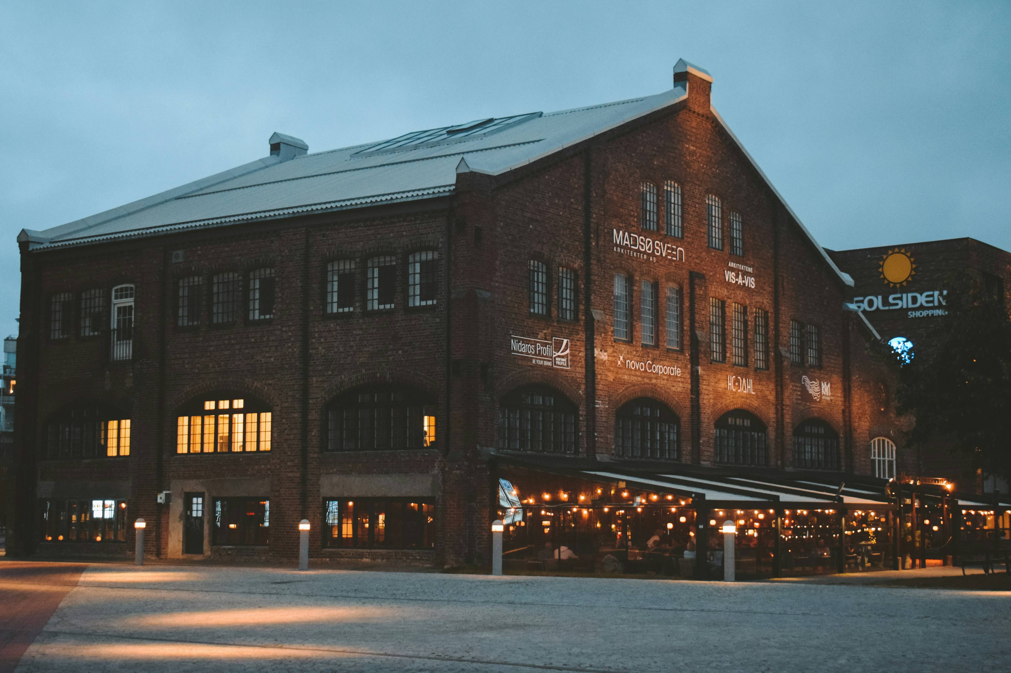lighted brown house during blue hour